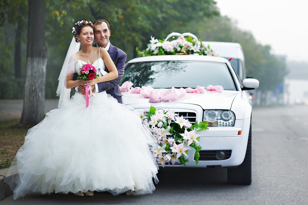 Happy bride and groom with Limo Hire